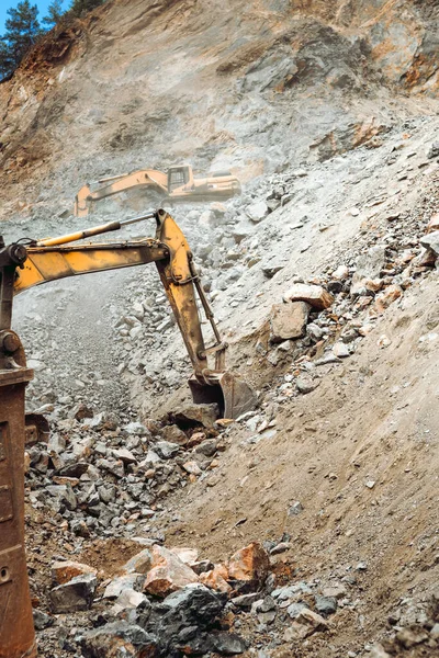Industrial machineries working on construction site. Details of excavators working on site