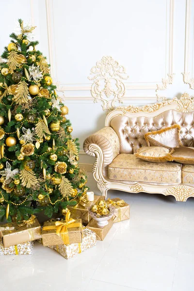 stylish vintage interior with decorated elegant Christmas tree and sofa