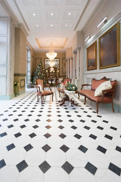 stylish vintage hall interior with decorated elegant Christmas tree