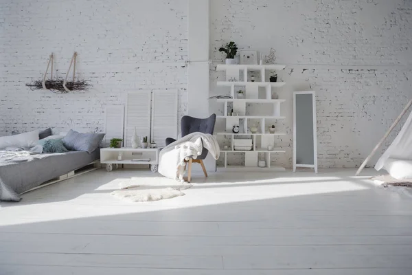 Modern interior design of studio apartment with white furniture