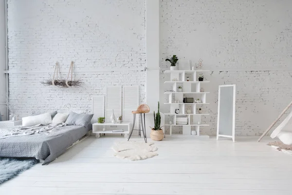 Modern interior design of studio apartment with white furniture