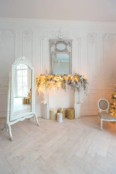 Light vintage interior with mirror and Christmas decorations