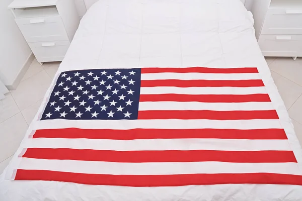 Above view of USA United States of American flag on white blanket — Stock Photo, Image