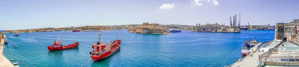 Panoramic skyline view of ancient defenses of Valletta and Grand Harbor with ship