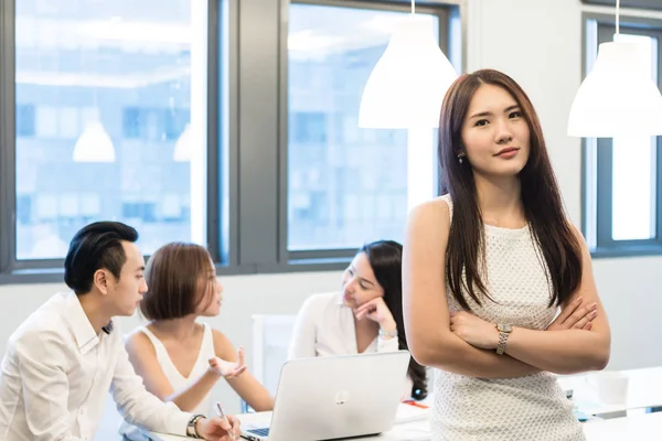 Young asian coworkers working in modern office — table, women - Stock Photo | #218688460