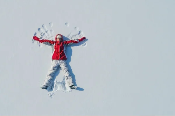 Top View Young Girl Lying Snow Making Angel Wings Copy — Stock Photo, Image