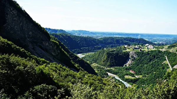 Mountain peak range landscape. Green mountain range view. Mountain peak blue sky white clouds panorama