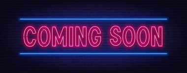 Yakında tuğla duvar arkaplanındaki neon betik işareti geliyor.