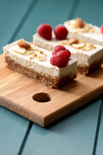 Vegan low calorie dessert. Coconut milk cheesecake bars decorate