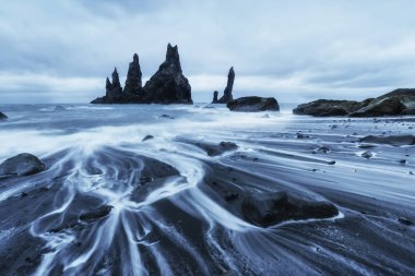 The Rock Troll Toes. Reynisdrangar cliffs. Black sand beach Iceland clipart