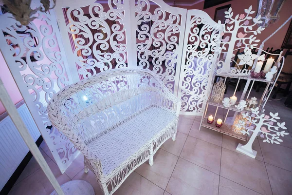 White wedding photo zone wooden sofa. Wedding accessories