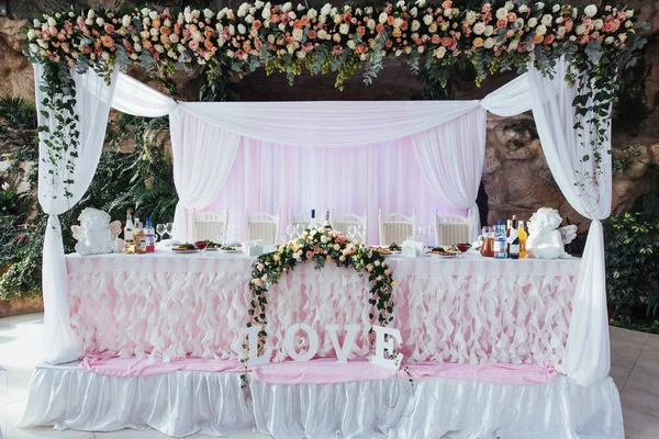 luxurious decorated table in the main hall wedding.