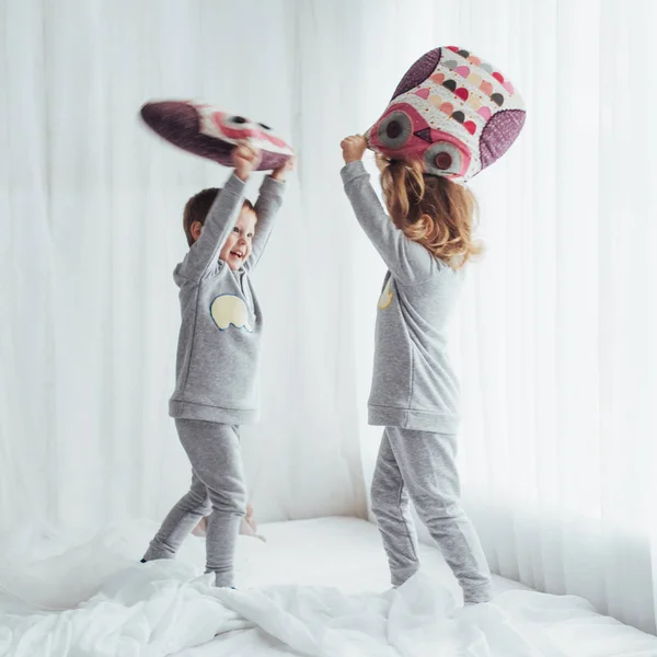 Children Soft Warm Pajamas Playing Bed — Stock Photo, Image