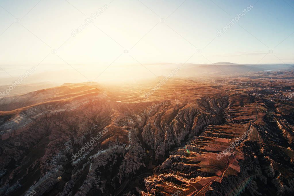 Fantastic sunrise over the Red Valley in Cappadocia, Anatolia, Turkey. Volcanic mountains in Goreme National Park.