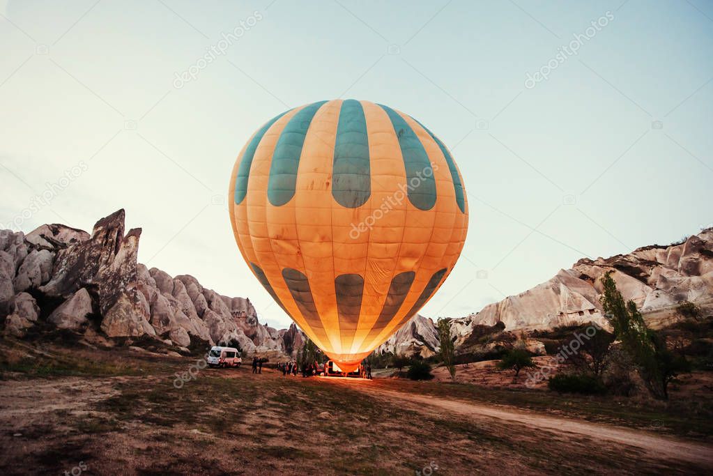 Cappadocia, Turkey. The first crew of flame and heat for inflating the balloon before launch. Balloon is one of the most famous of that trip will have to do in Cappadoci