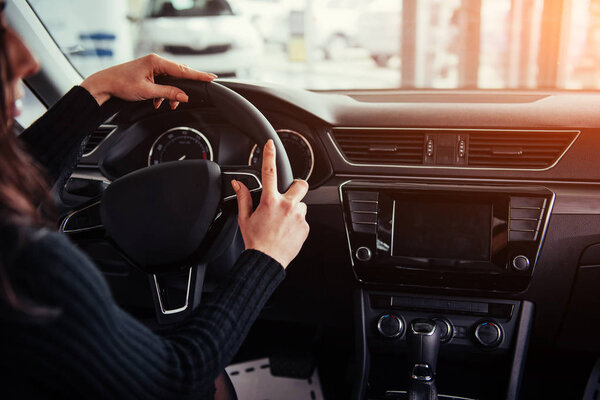 Modern car interior dashboard and steering wheel.