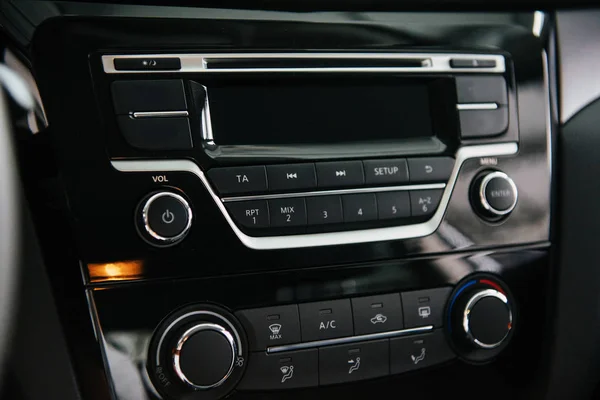 Car audio system front panel. of beautiful modern car close up in the cabin.