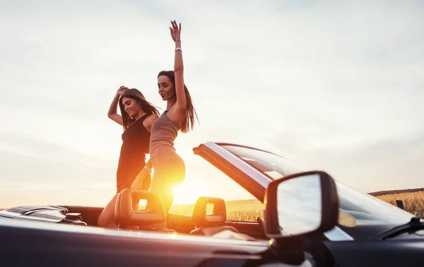 Young Two Women Photo Shoot Girls Gladly Posing Next Black — Stock Photo, Image