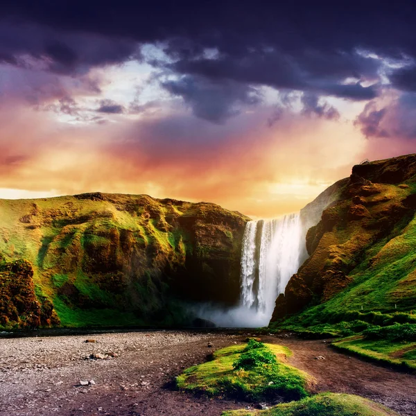 Great waterfall Skogafoss in south of Iceland near the town of Skogar. Dramatic and picturesque scene
