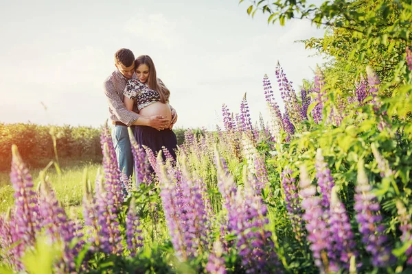 Happy Beautiful Girl Pregnant Her Husband Outdoors Background Flowers — Stock Photo, Image