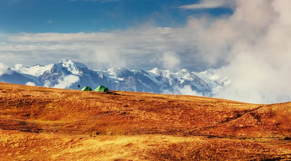 Tent green spread out on the pass Goulet. Georgia, Svaneti. Europe. Caucasus Mountains