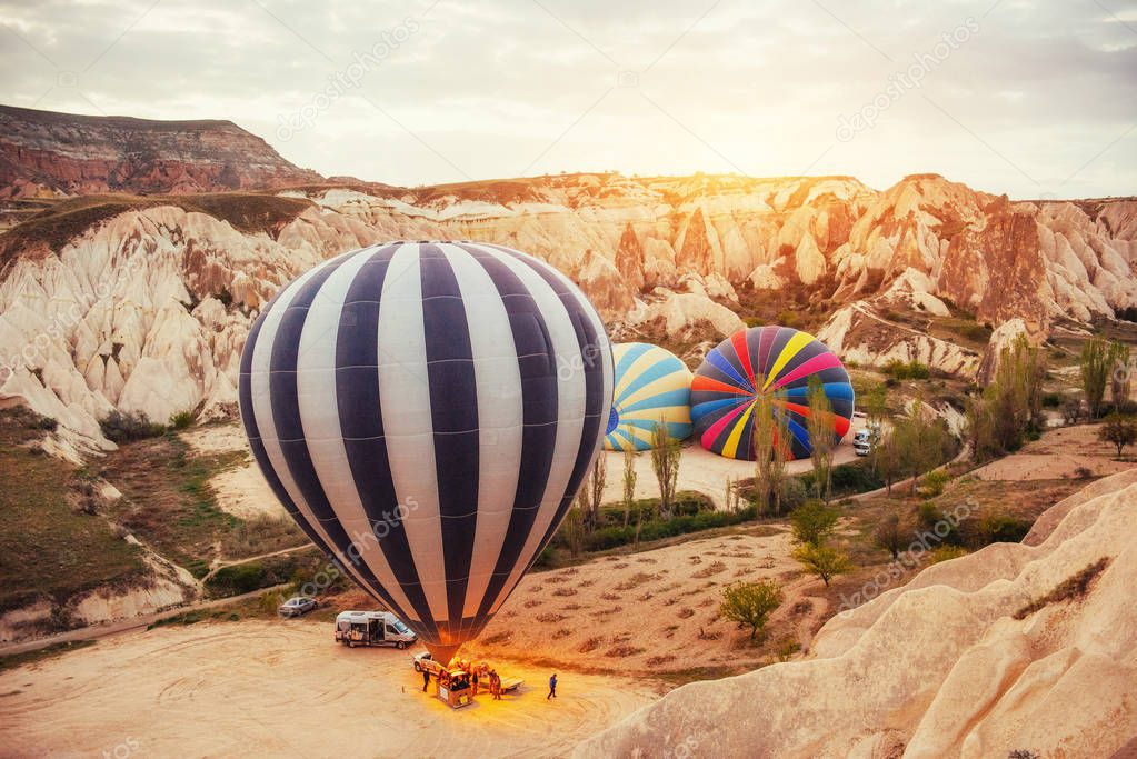 Cappadocia, Turkey. The first crew of flame and heat for inflating the balloon before launch. Balloon is one of the most famous of that trip will have to do in Cappadoci