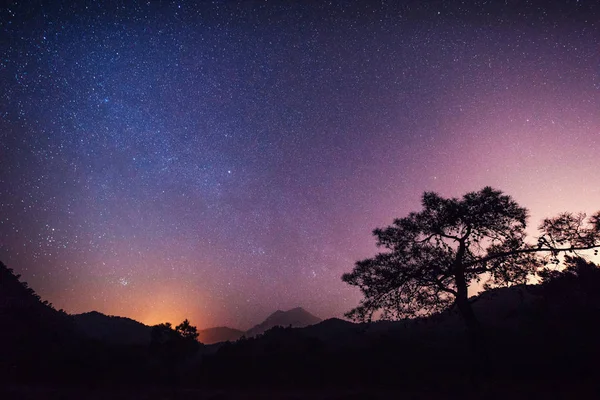 fantastic winter meteor rain and mountains in the mist.