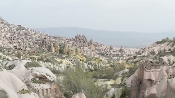 View of cave houses in rock formation at Ortahisar. Cappadocia. Nevsehir Province. Turkey — Stock Video
