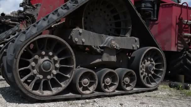 A huge caterpillar tractor shot close-up costs on the repair base — Stock Video