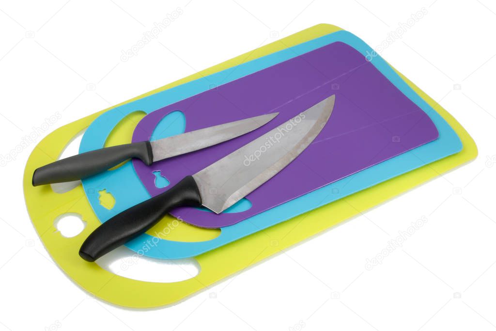 Plastic kitchen cutting board with knife isolated on the white