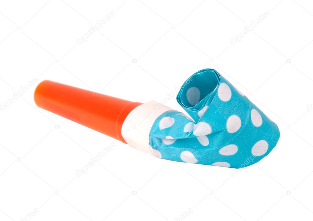 Rolled festive noisemaker or party whistle horn on the white isolated