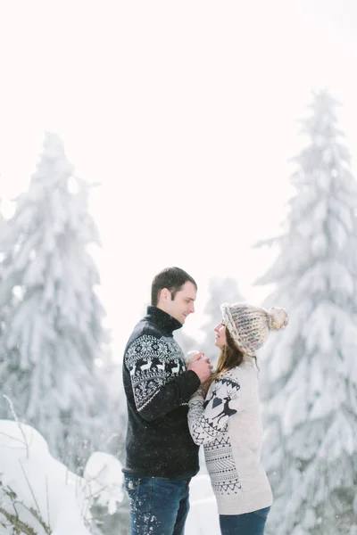 Happy Couple Hugging Snowy Winter Spruce Wood — Stock Photo, Image