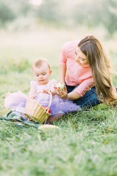 Happy Mother Child Baby Girl Playing Fruits Blooming Spring Garden — Stock Photo, Image