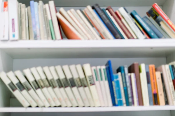 books on bookshelf in library, abstract blur defocused background