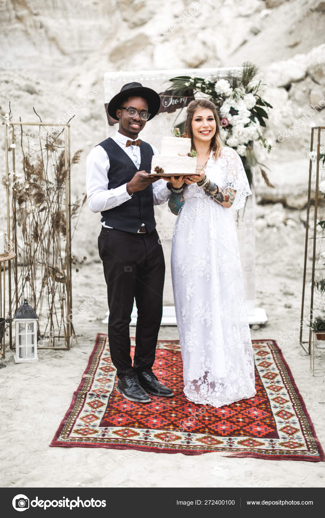 Couple African man and Caucasian woman in their boho wedding