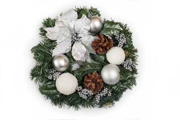 Beautiful Christmas wreath decoration with white flowers isolated on white background