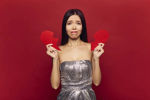 Sad single girl with big broken heart. Valentine's day and love concept, divorce