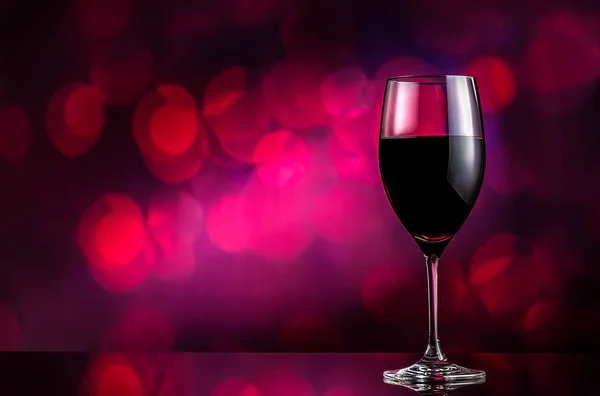 Vino tinto sobre fondo bokeh —  Fotos de Stock