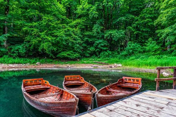 Wooden boats on lake — Stock Photo, Image