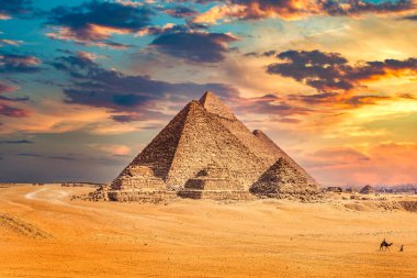Egyptian pyramids at sunset clipart