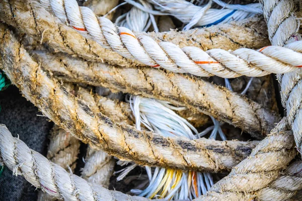 Nautical background of old frayed boat rope