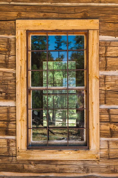 An old window on a rustic cabin