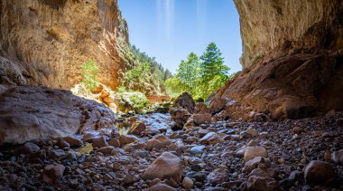 Inside Tonto Natural Bridge Panorama with a Waterfall clipart