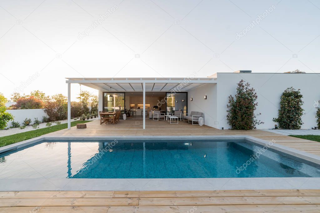 Exterior and interior modern white villa with pool and garden