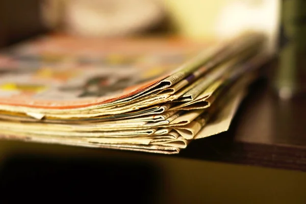 Bunch of newspapers. Stack of folded papers with news, side view