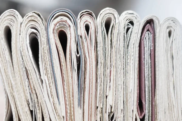 News Folded Newspapers Stacked Row Selective Focus Papers Blurred Background Royalty Free Stock Photos