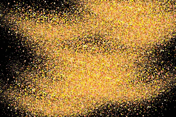 Gold glitter explosion. Splashes of golden particles. Abstract grainy texture isolated on black background
