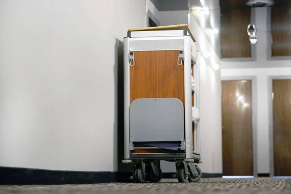 Cleaners trolley with cleaning equipments at hotel