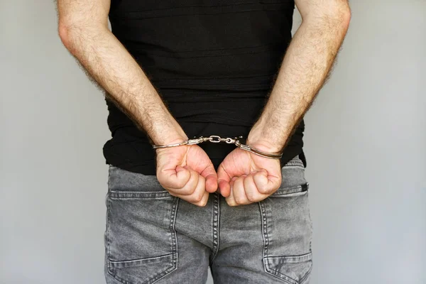 Close Arrested Man Handcuffed Hands Back Isolated Gray Background Prisoner — Stock Photo, Image