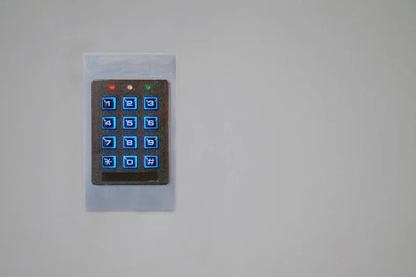 Secure password on keyboard for opening home house door. Password code Security keypad system protected in Public Building. The security code combination to unlock the door